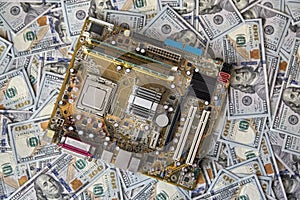 Circuit board chips, electronics, against the background of money. The concept of technological progress