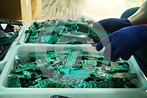 Circuit board parts are being disassembled as electronic waste in the factory