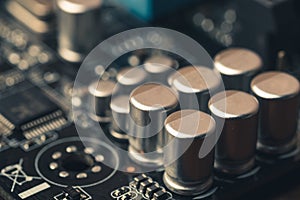 Circuit board with transistors and computer processors as abstract technology background