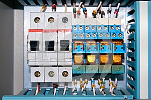 Circuit breakers and electrical relays with connected wires.