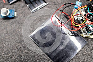 Circuit with wires and connections to a microcontroller built by students for engineering and educational informatics activities.