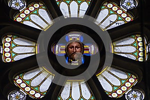 Circular beautiful religiously decorated windows of the Basilica of St Peter and St Paul at Vysehrad, Prague