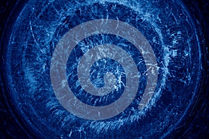 Circular brushed metal background. Distressed overlay texture of rusted peeled metal. runge background. Trend color classic blue.