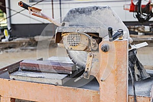 The circular diamond saw cuts concrete paving slabs. Concrete cutting machine close-up