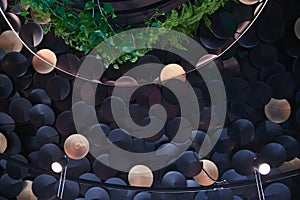 Circular discs on the ceiling with glowing lanterns