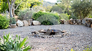 A circular fire pit surrounded by a mix of gravel and pebble rocks creating a serene and natural atmosphere. 2d flat