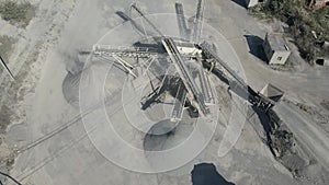 Circular flight over the conveyor belt in work process, transportation and separation of gravel.