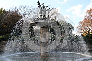Circular fountain with statues in Showa Memorial Park