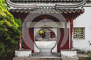 Circular gate to traditional Chinese house on Tiger Hill Huqiu, Suzhou, Jiangsu, China