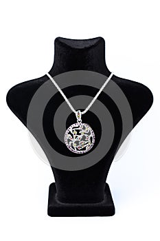 Circular pendant on a mannequin isolated on white