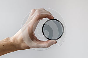 Circular polarizing filter in hand.