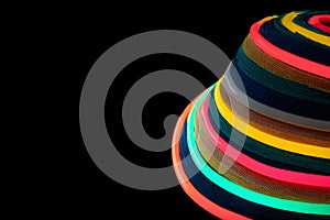 Circular rings of rainbow neon light, glowing softly, dark center left open for design