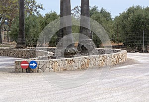 Circular road signs direction stone wall