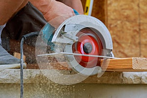 Circular Saw. Carpenter Using Circular Saw for wood beam