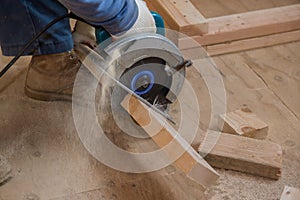 Circular saw carpenter using for wood beam