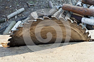 Circular saw. Circular Saw on wooden background with daylight.