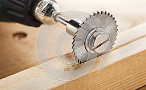 circular saw for milling machine cutting hole in wooden plank