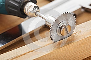 circular saw for milling machine cutting hole in wooden plank