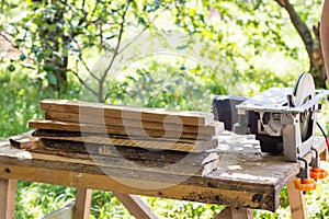 Circular saw for wood and tree trunks in sawmill close up. Processing of wood for boards or other building materials