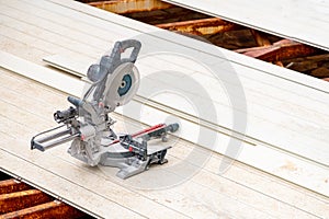 Circular saws standing on the assembled composite Deck