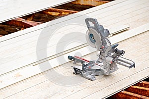 Circular saws standing on the assembled composite Deck