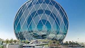 Circular skyscraper Aldar Headquarters Building timelapse hyperlapse in Abu Dhabi, UAE.