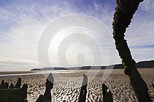 Circular sun halo as viewed from beside a boatwreck on Red Wharf Bay, Area of Outstanding Natural Beauty, Anglesey, North Wales