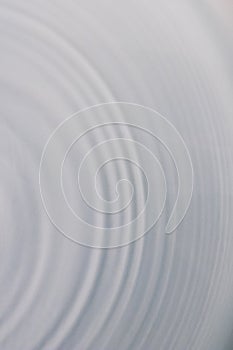 Circular wave motion in a fluid system. blue gray background for
