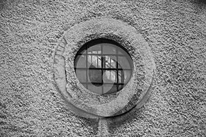 A circular window in the industrial zone