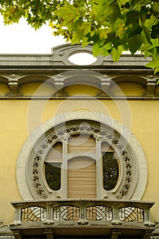 Circular window of a secessionist house. Quaroni house in Novara inspired by the principles of the Viennese secession