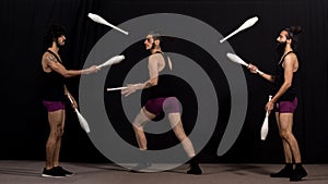 Circus jugglers during their batons performance