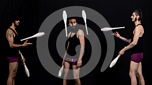 Circus jugglers during their batons performance