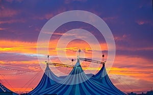 Circus tent in a dramatic sunset sky colorful