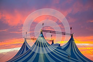 Circus tent in a dramatic sunset sky colorful