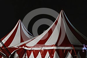 Circus tent illuminated at night. Festive attraction in the city