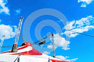 Circus tent under the blue cloudy sky