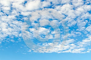 Cirro-cumulus clouds in blue sky photo