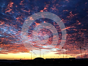 Cirrocumulus fire cloud in a sunset in airport