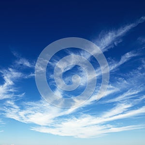 Cirrus clouds in blue sky.