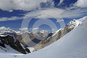 Cirrus clouds in a blue sky over mountain landscap