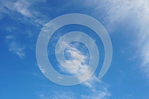 Cirrus clouds on the bright blue sky background