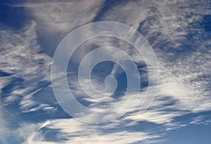 Cirrus clouds high in the blue sky