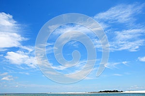 Cirrus clouds over ocean photo