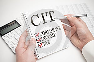 cit, corporate, income, tax, written in notebook on the white background photo
