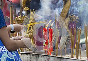 Citizens light incense and candles to pray for blessings from gods