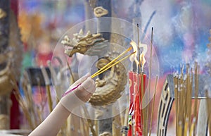 Citizens light incense and candles to pray for blessings from gods