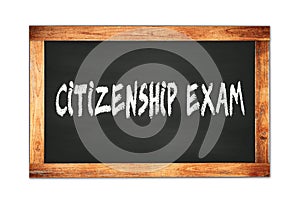 CITIZENSHIP  EXAM text written on wooden frame school blackboard