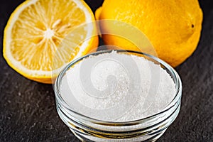 Citric acid on a dark stone background