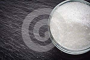 Citric acid on a dark stone background