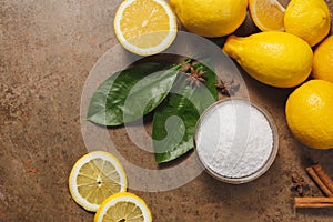 Citric acid and Lemons on the brown background.